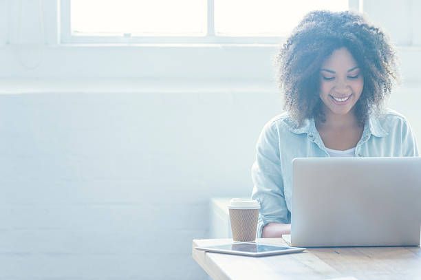 Woman working on a laptop.
