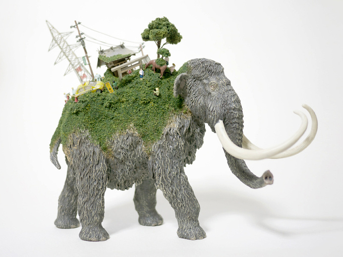 Toy Mammals and Dinosaurs Burdened with Miniature Civilizations by Maico Akiba toys sculpture miniature dioramas #sculpture #tusk #mammoth #mammal #elephant #juxtapositon #back #civilisation #miniature