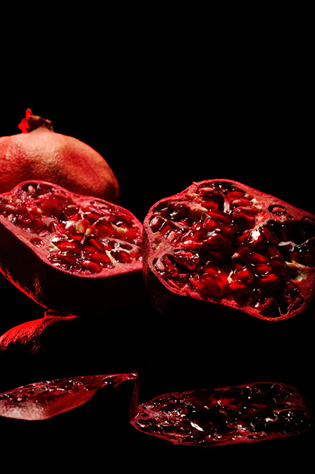 Juicy Pomegranate by Niermala B. Timmers www.niermalatimmers.com #drama #timmers #red #pomegranate #juicy #photo #fruit #bouwina #contrast #black #mirror #shiney #photography #healthy #niermala #hard #lighting #still #life #shadow