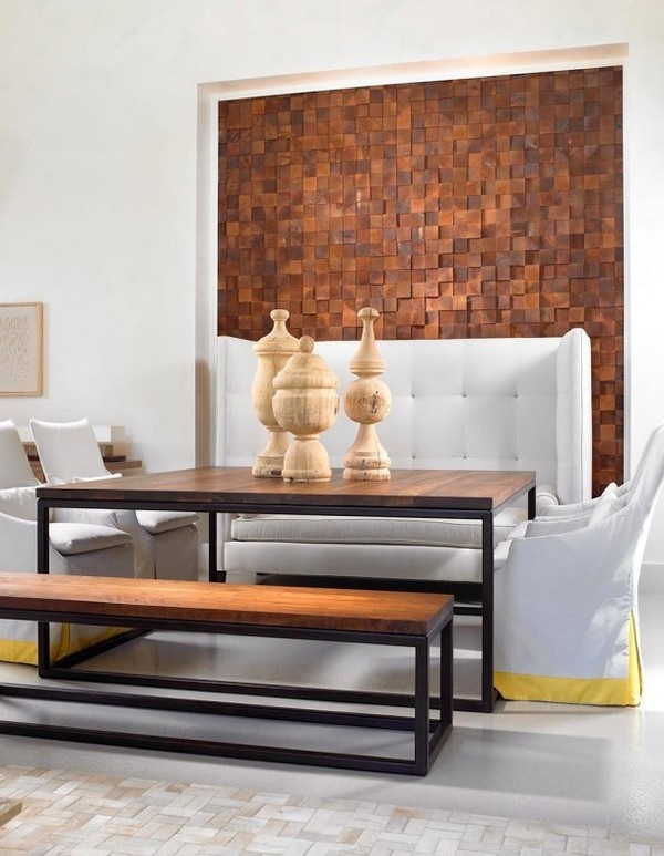 Artistic wall decor and sculptures on table in living area with white sofa set #interior #house #artistic #decor #art #paintings #residence