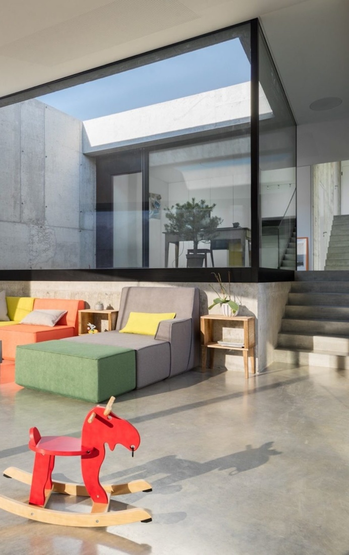 Massive Concrete Family House with Generous Inner Apertures to the Light 3