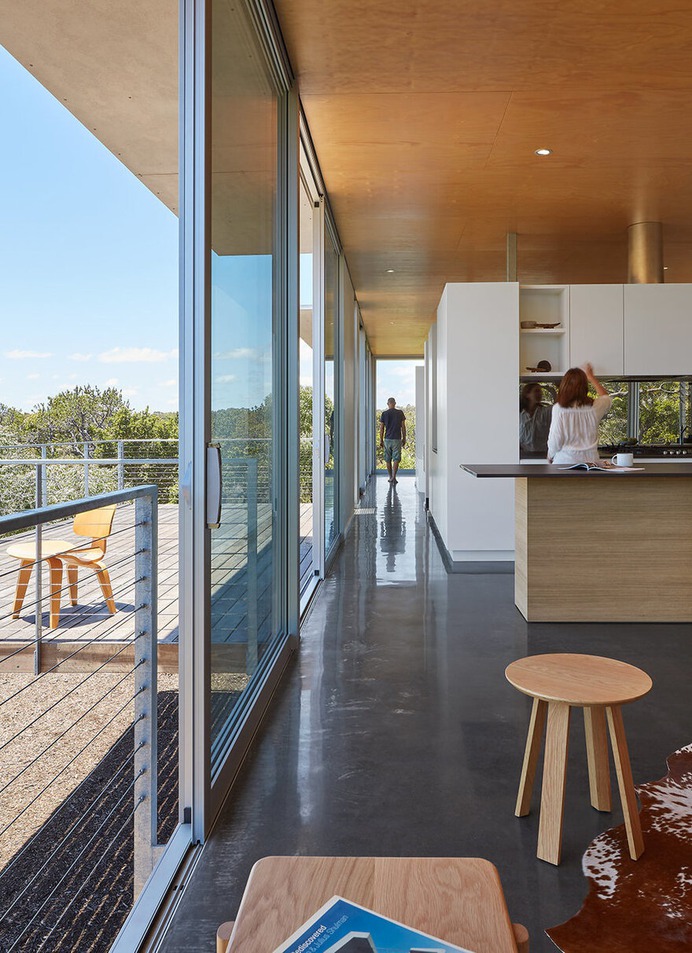 Wilderness House is a Elevated Platform with Large Areas of Glass