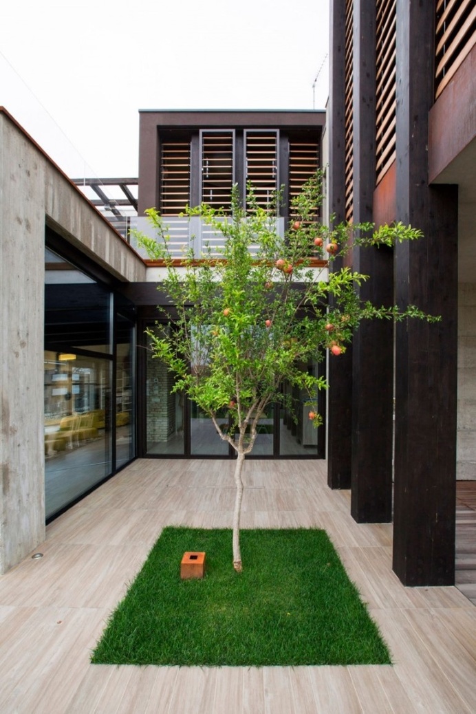 Modern Concrete Block House with Wooden Patio Attached