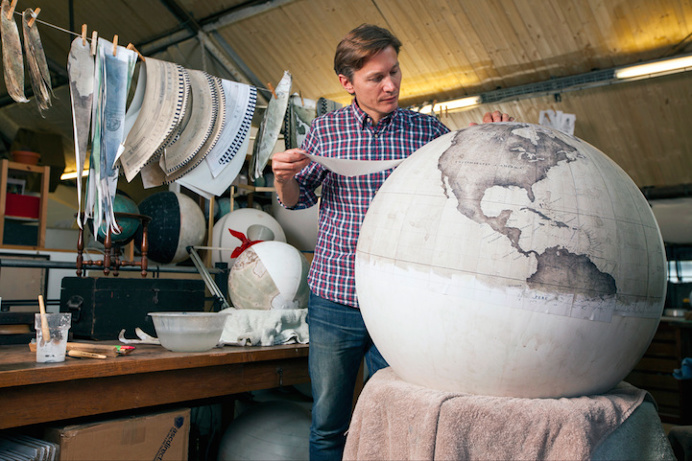 painting a globe.