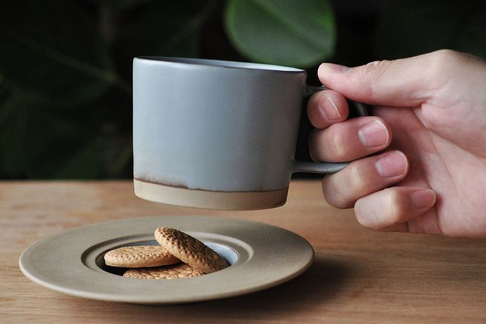 MARUHI: Cup and Saucer - IPPINKA Shigeru Fukuoka has created the perfect MARUHI cup and saucer for a special surprise during your morning coffee. The saucer dish has a small decline in it that's perfect for biscuits, chocolates and more!