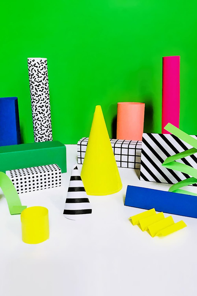 Our simple Memphis style-inspired DIY paper shapes are a fun way to introduce kids to sculpture, pattern, color and shapes! Cut, add, stack, paste, rearrange and more!