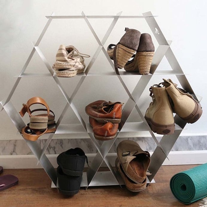 Organize your belongings with this strong, geometrical shelving unit.
