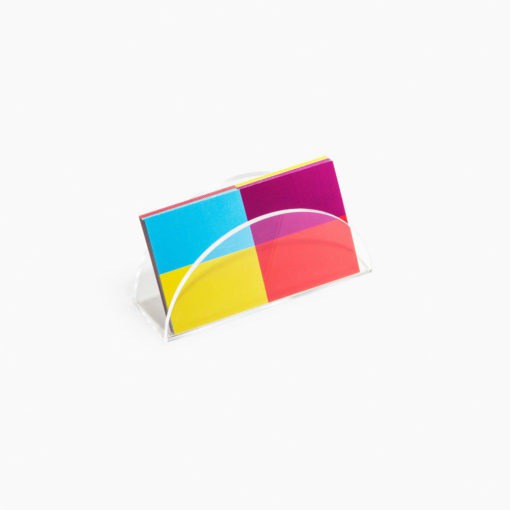 Lucite Business Card Holder Hold your call cards in style with this Lucite Business Card Holder. Made out of acrylic, it's a stylish way to display not only cards but also small pictures. Designed in the United States.