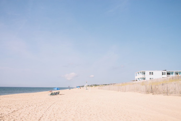 seashore under blue sky during daytime