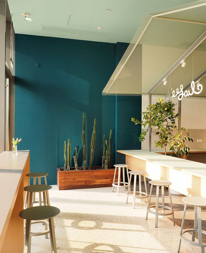 Shining Metal Bar at Seesaw Coffee by NOTA Architects - InteriorZine