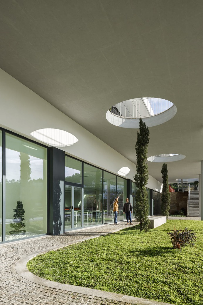The Balcony That Extends the Landscape in an Industrial Building