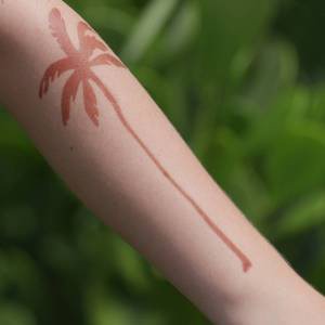 Palma - palm tree temporary tattoo on arm Modern henna tattoo designs now include a large, minimalist palm tree via Mihenna's adhesive stencils. Our henna stencils help you achieve a flawless look.