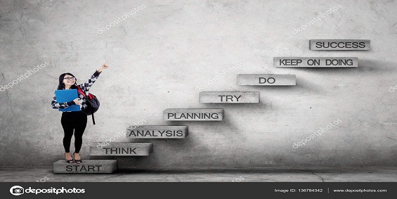 College student pointing success text on stairs
