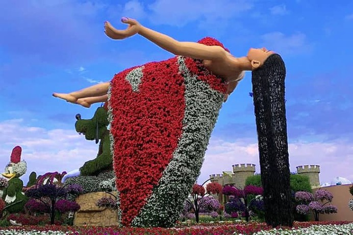 Aerial floating lady at Dubai Miracle Garden. This floating lady became part of the Dubai Miracle Garden in 2019 (Season 8). This floral theme gave an impression of the aerial floating lady and also grew flowers on its dress.