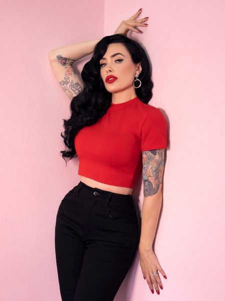 The Bad Girl Top is the ultimate vintage inspired cropped top for the modern Bad Girl! Made of a custom heavy yet soft knitted cotton/spandex. Has no zipper and pulls right on, and is cropped to show just the right amount of skin in your high waisted items. It will surely get you into the right kinds of trouble. Wear i