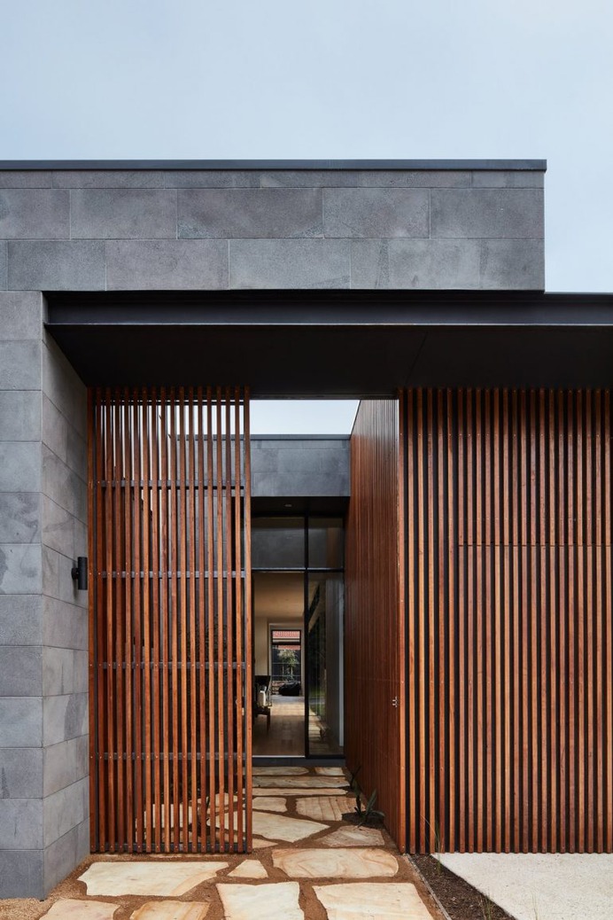 A Striking Courtyard Awaits Behind These Bluestone Walls