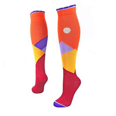 Designer performance compression socks with mountains on a moonlit sky in orange