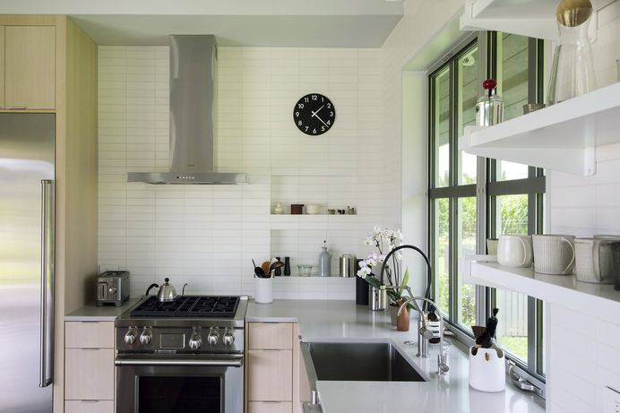 Kitchen, Wood Cabinet, Engineered Quartz Counter, Concrete Floor, Range, Ceramic Tile Backsplashe, and Refrigerator Upcountry Maui Cottage and Barn: kitchen Photo 87 of 2509 in Best Kitchen Photos from Haiku Maui