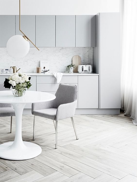 Bright kitchen with light gray cabinetry styled by Corina Kock and photographed by Kristina Soljo for Real Living magazine