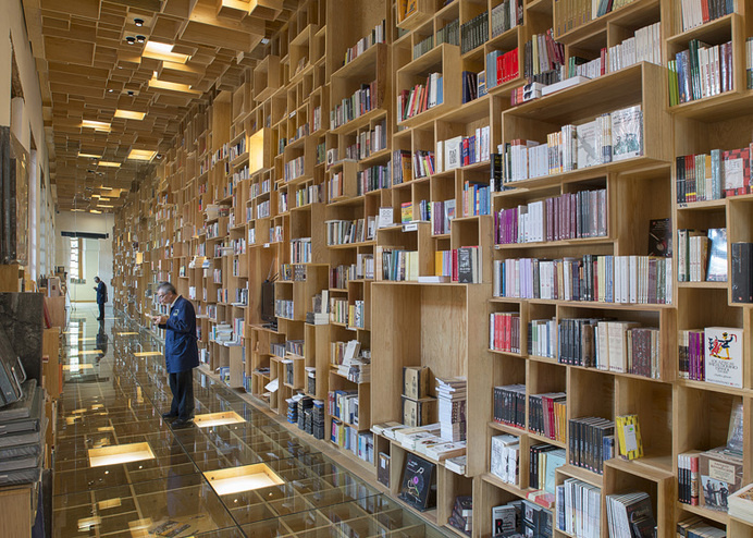 Mexican library renovation by Taller 6A with bookshop covered in boxes #interior