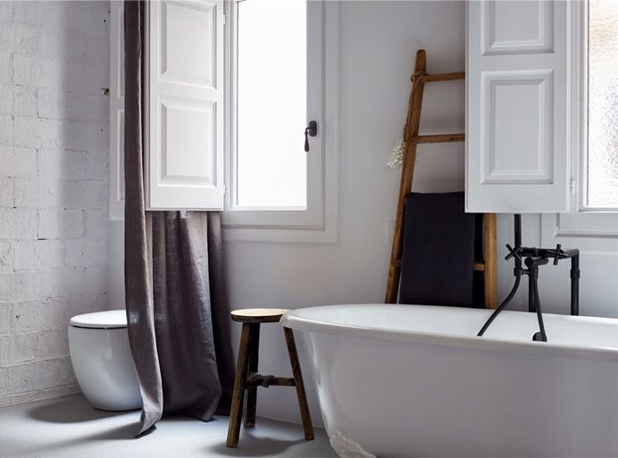 Brick Walls and Wooden Roof Structures Give Character to Barcelona Apartment #bath #interior #decor