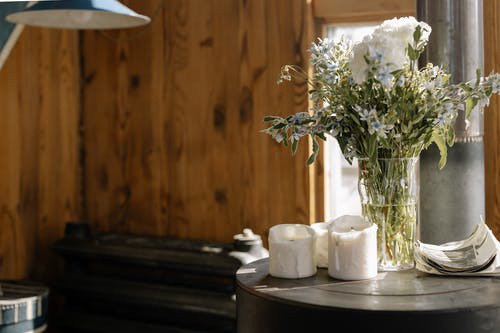 White Flowers in Clear Glass Vase on Black Table