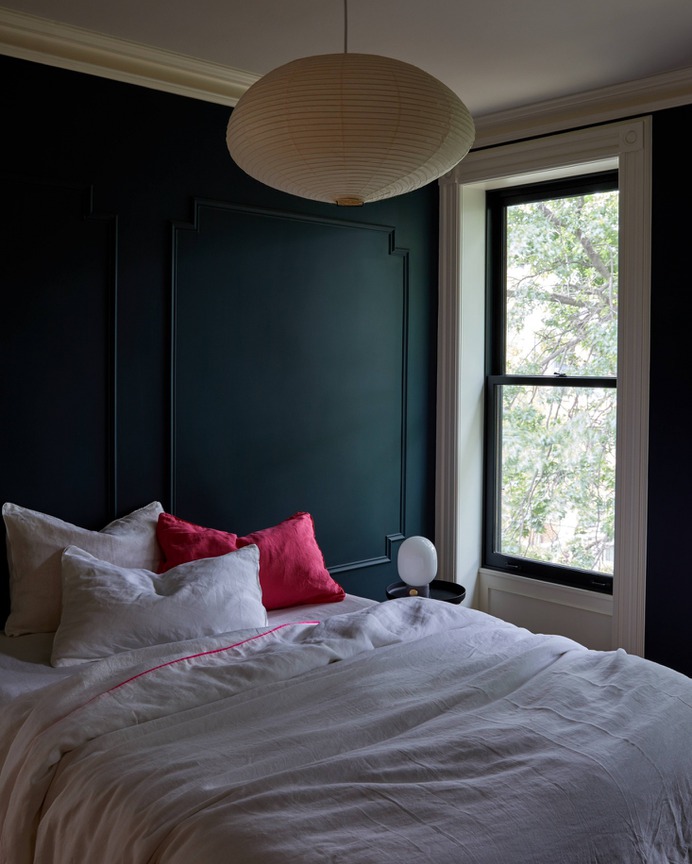 Noguchi lights are arresting enough to hold center court in public spaces—yet understated and intimate enough for bedrooms, like this one. Photograph by Kate Sears; styling by Kate S. Jordan, from The Sentimental Minimalist: A Young Architect's Bed-Stuy Townhouse Makeover.
