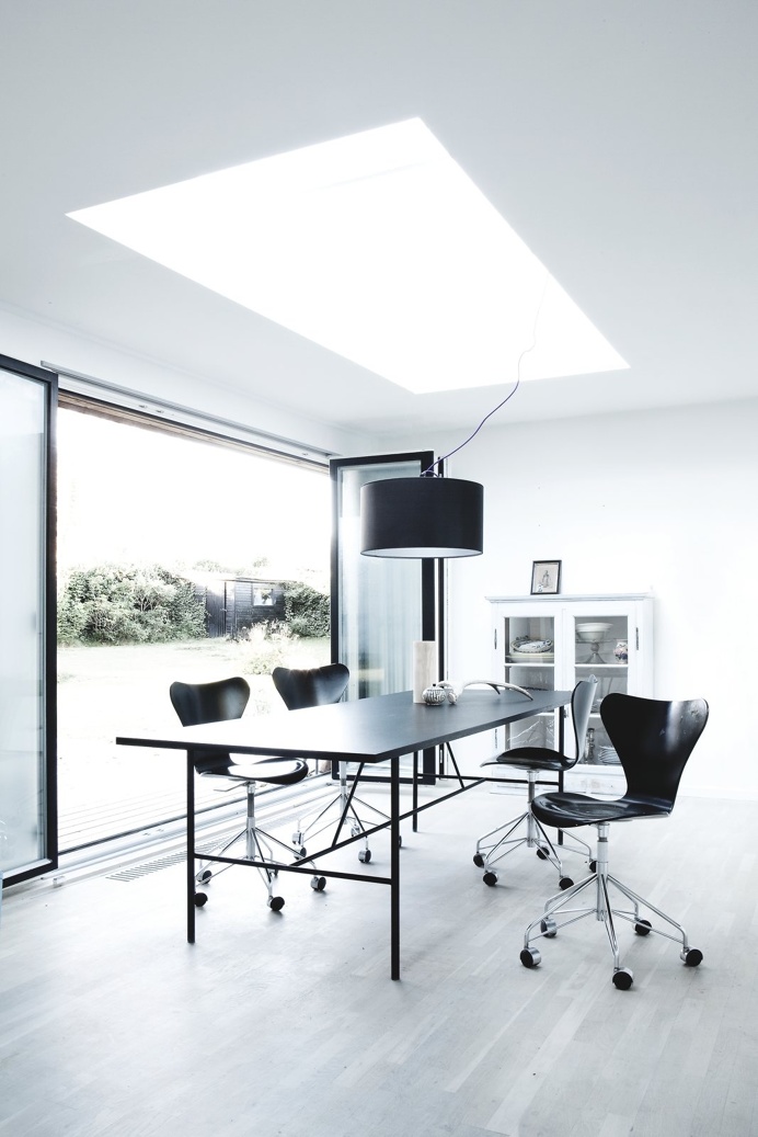 Dining area with skylight. Bang House by Norm.Architects. #normarchitects #diningroom