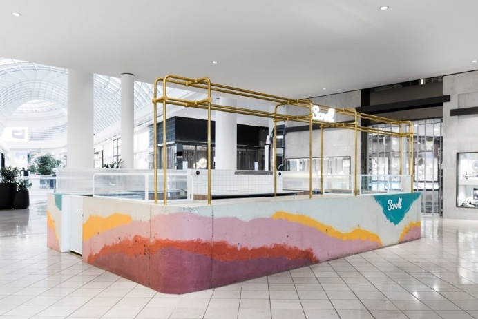Multicoloured concrete bar forms ice cream stand inside Victoria shopping centre