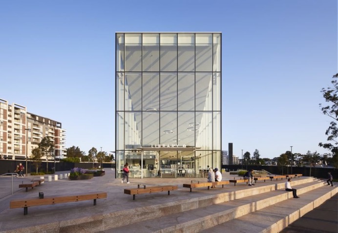 front of glass triangular building