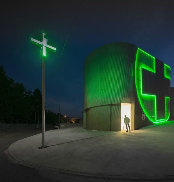 Very cool pharmacy in Portugal with neon sign incorporated into facade, farmacia lordelo in Vila Real, Portugal by Jose Carlos Cruz, Arquite