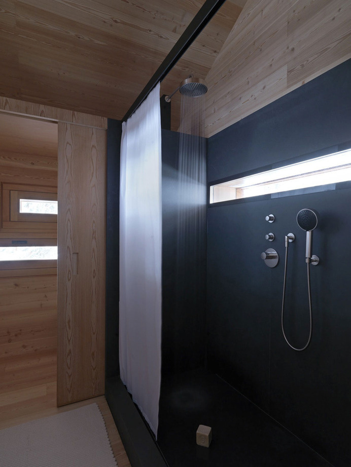 cozy-mountain-cabin-can-open-to-elements-8-bathroom.jpg #shower #bedroom #architecture #cabin #light #windows
