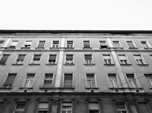 Hundreds of windows, hundreds of stories #old #white #house #budapest #black #stories #building #and #windows