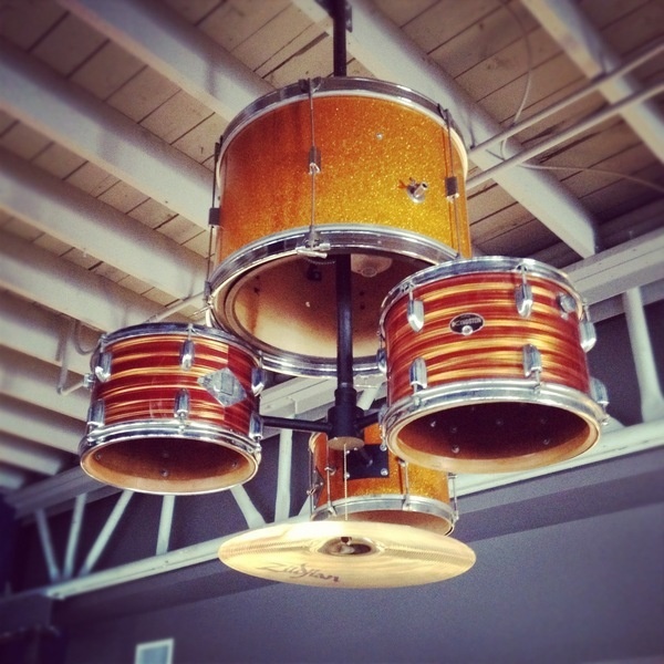 A restaurant light fixture made out of an old drum set. #interior #lighting #design #drums