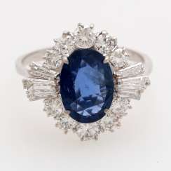Ladies ring set with a oval faceted sapphire