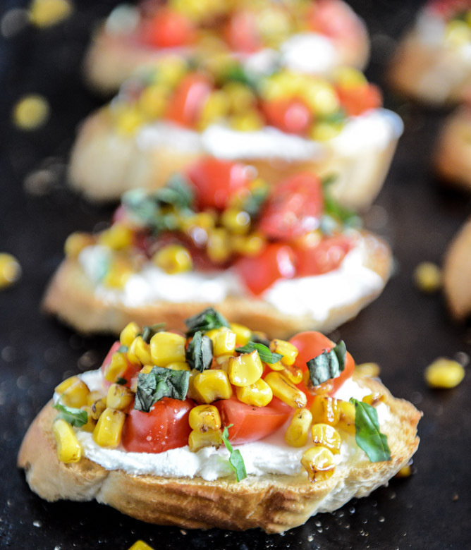 summer crostini with whipped roasted garlic goat cheese. #cheese #whipped #goat #crostini #garlic #summer #roasted #with
