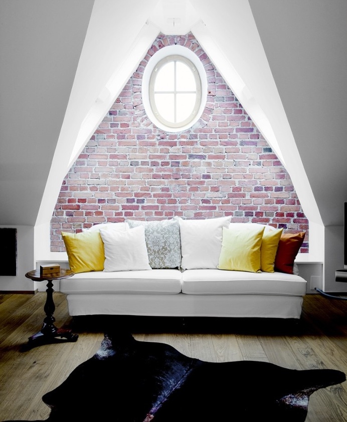 Howard White Sofa Against Decorative Brick Wall