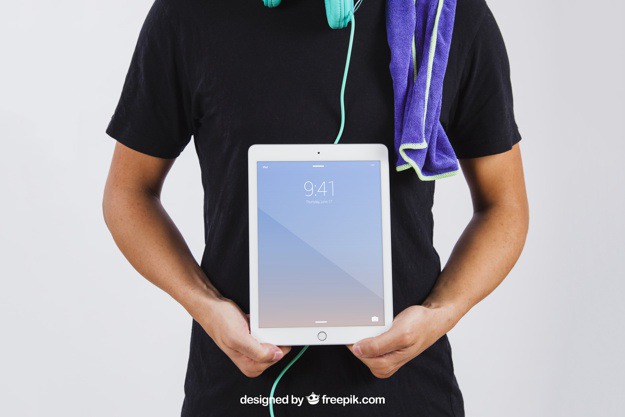 Man in summer wear showing tablet Free Psd. See more inspiration related to Mockup, Technology, Summer, Template, Man, Mock up, Tablet, App, Screen, Device, Up, Towel, Guy, Holding, Wear, Mock and Showing on Freepik.