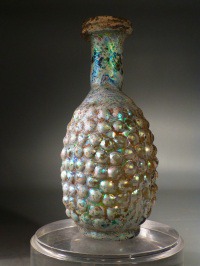Roman molded amber glass grapes flask