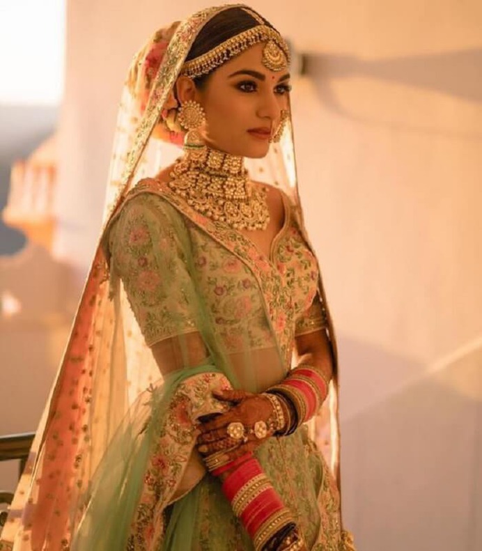 green lehnga with heavy jewellary