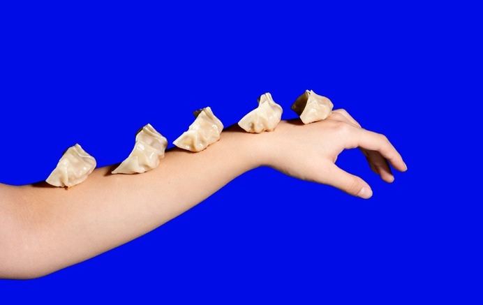 We were hired by a Toronto-based digital restaurant to create a brand identity, print and digital applications for their launch. The inspiration for the identity came from the story of the semi-historical Chinese monk, Budai, who allegedly lived in 10th century China. Hand held out with a parade of dumplings lined up on it.