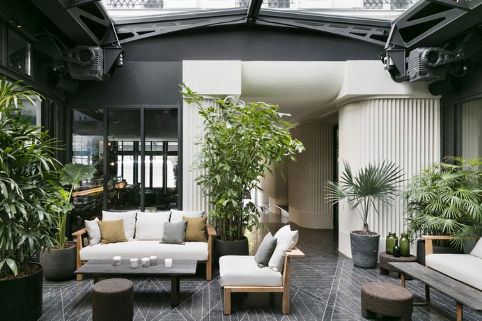 Inside the lobby. The stone and metal interiors take cues from the Conservatoire National des Arts & Métiers—the renowned French institution for science, engineering, and inventions—just across the street.