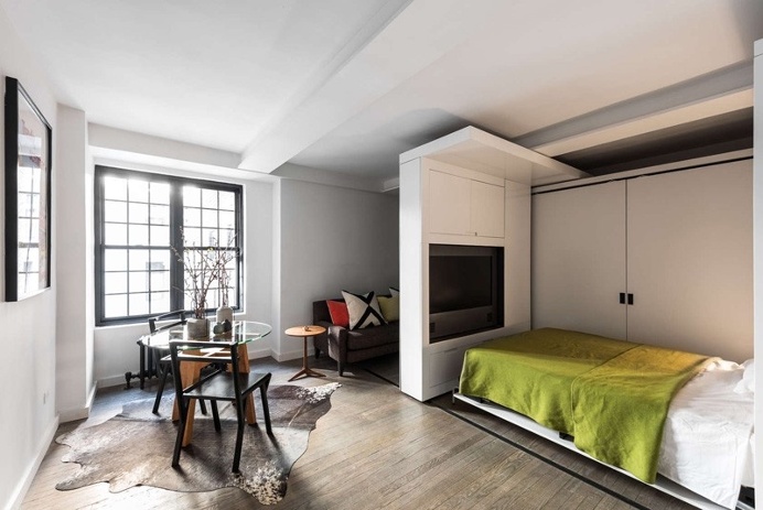 This apartment uses a mechanized moving wall to form different areas