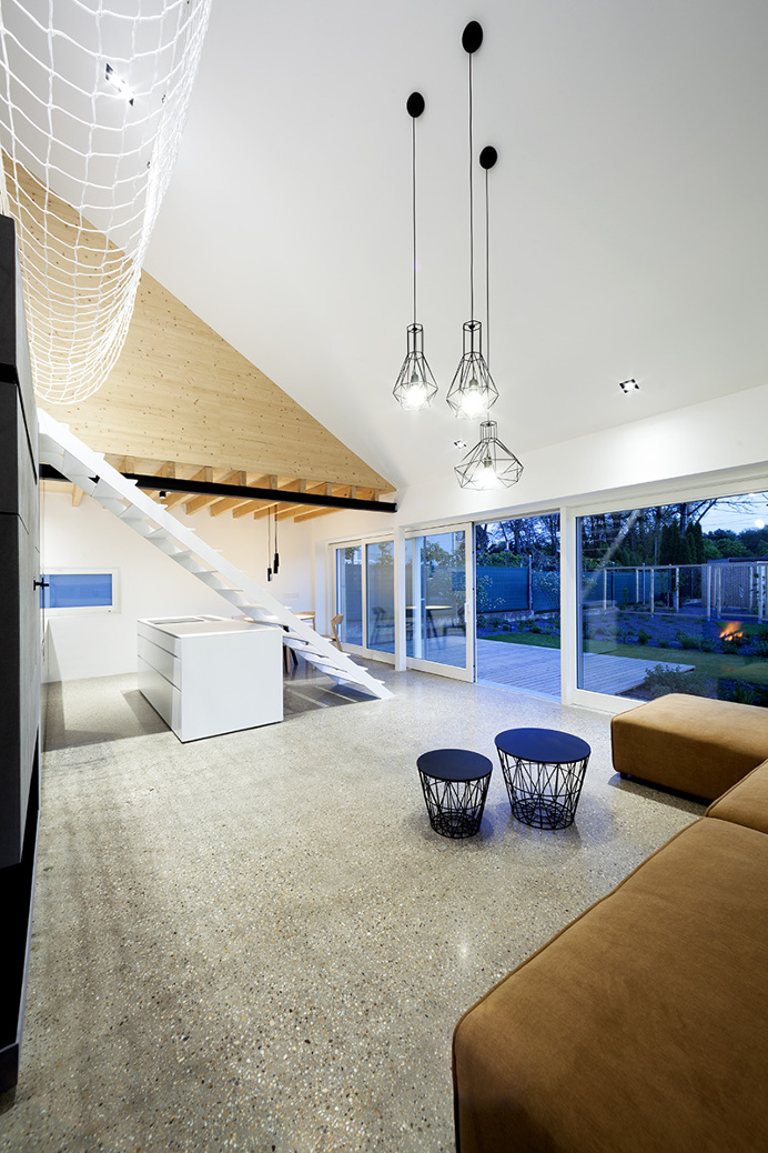 "Under the Calvary" House Has Traditional Shape and Modern Interiors