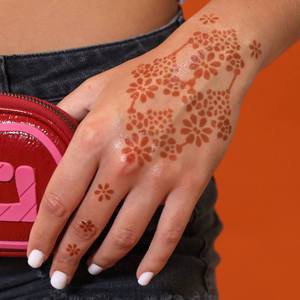 Flower Power - floral henna tattoo on back of hand Mihenna offers a variety of floral henna designs for your hands, including our hippie-inspired Flower Power Stencil. Use this sticker stencil for easy application.