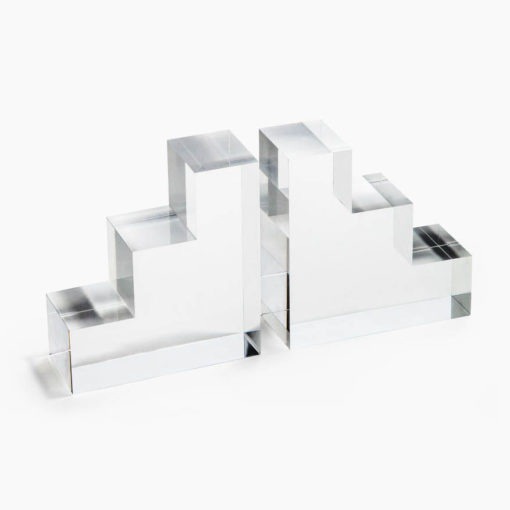 Lucite Bookends These Lucite Book Ends are a fantastic way to display your books atop a shelf. Featuring a stepped design, they elevate the space and add visual interest.