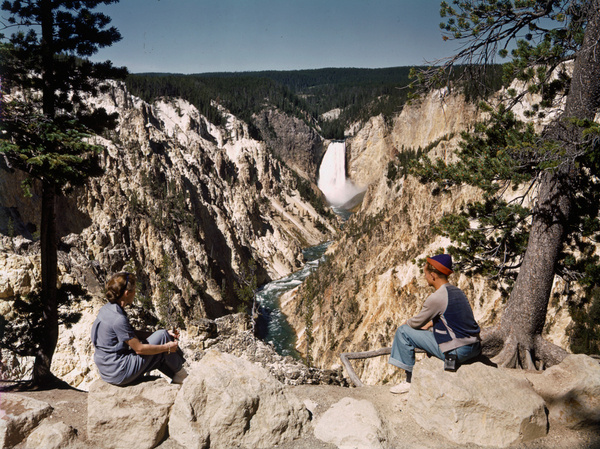 Vistors sit on an overlook to see scenic views in Yellowstone National Park, June 1940.Photograph by Edwin L. Wisherd, National Geographic #film #nat #nature #photography #vintage #yellowstone #geo