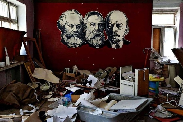 The portraits of Marx, Engels, and Lenin are seen on the wall of a shelled rehabilitation center for alcohol and drug addicts in Sloviansk