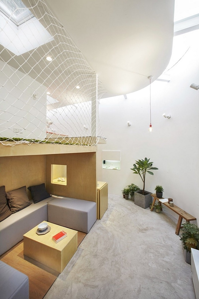 L-shaped House Composed of Wooden Boxes / B.L.U.E. Architecture