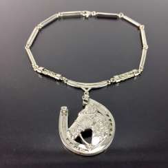 Ludwig Zepner: necklace with pendant, a representation of a horse's head in horseshoe, silver and platinum, one of a kind, 1995.